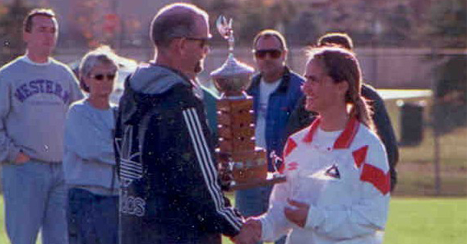 Josie Tucceri collecting the OCAA Championship trophy in 1998.